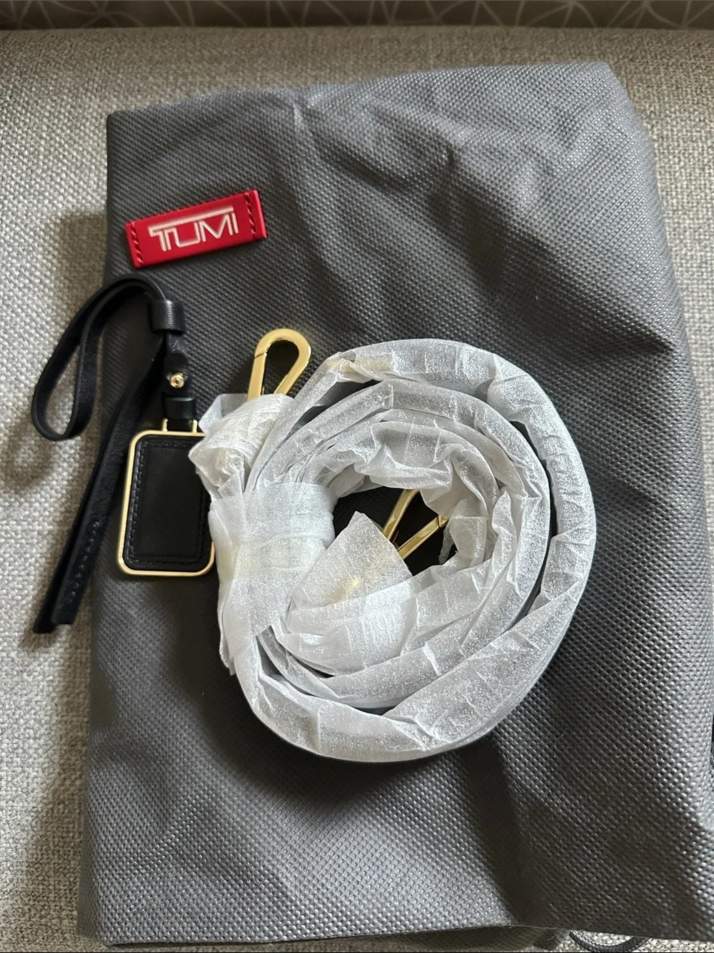 Tumi Leather Adrian Voyageur with Gold Hardware